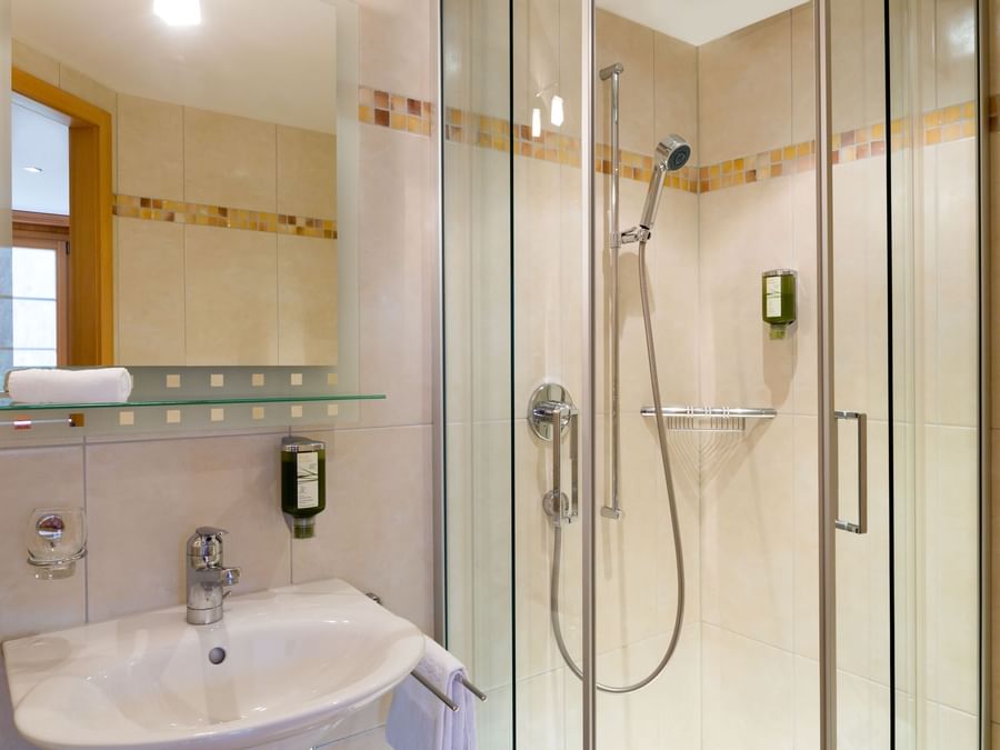 Bathroom interior in bedrooms at Hotel & Apartments Kirchbuehl