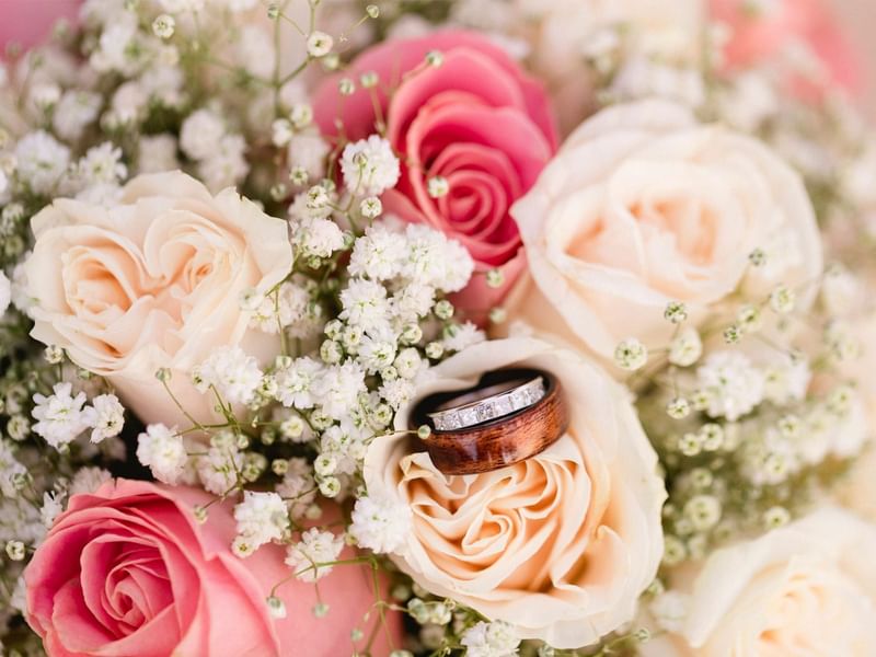 Close-up of flower bouquet with wedding ring at Grand Fiesta Americana