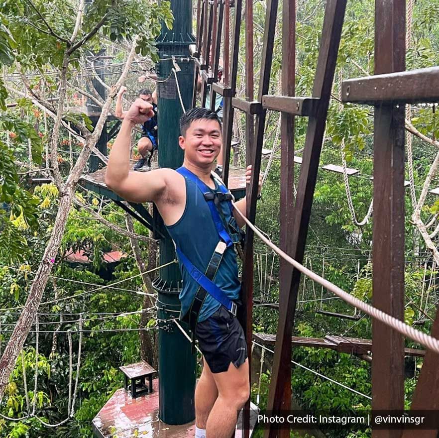 A man was engaging in a high-rope course activity at ESCAPE Penang Theme Park - Lexis Suites Penang