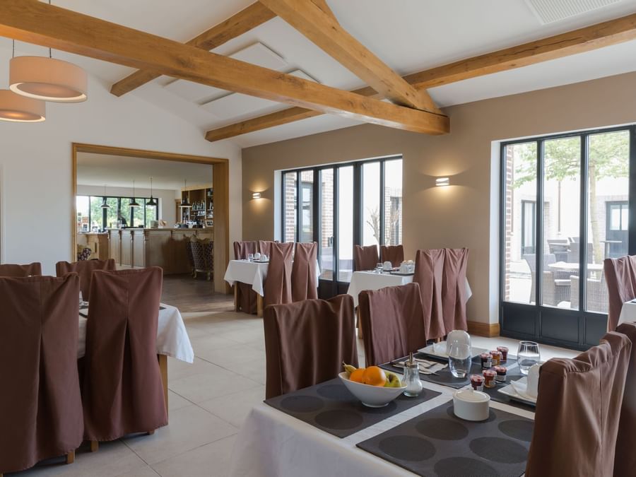 Dining tables set up in  Auberge du Moulin a Vent
