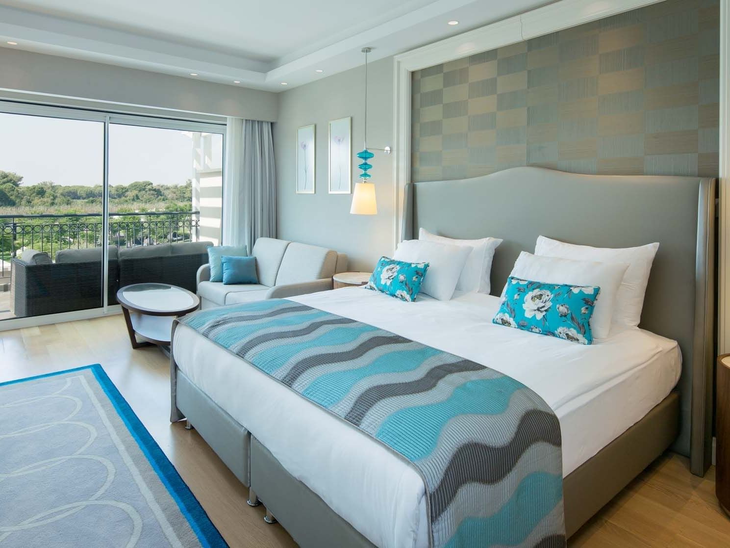 Sitting area by the bed in Family Pool Balcony Suite at Titanic Deluxe Golf Belek