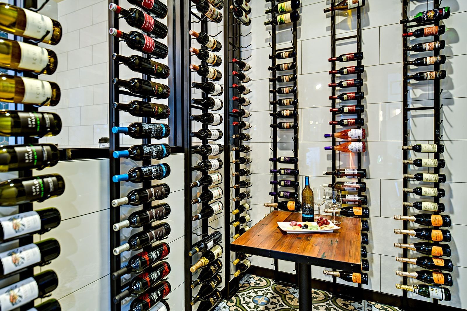Wine bottles hanging on a wall in Trillium Restaurant at Grove