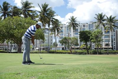 Golf player in Playa Dorada Golf ground near Blue JackTar Hotel