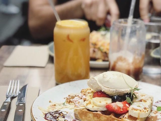 Waffles and orange juice served at Brady Central Melbourne