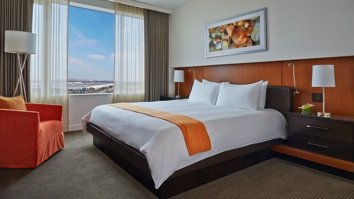 Hotel bedroom with large bed and window view