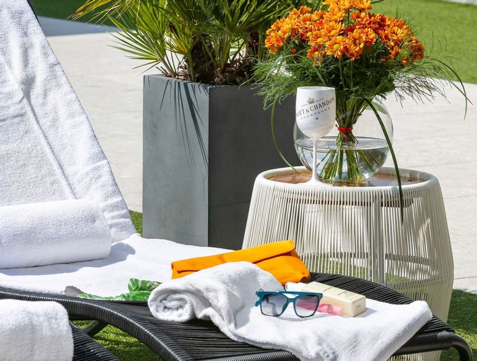 A Garden pouf by a sunbed at Hotel Emperador Buenos Aires