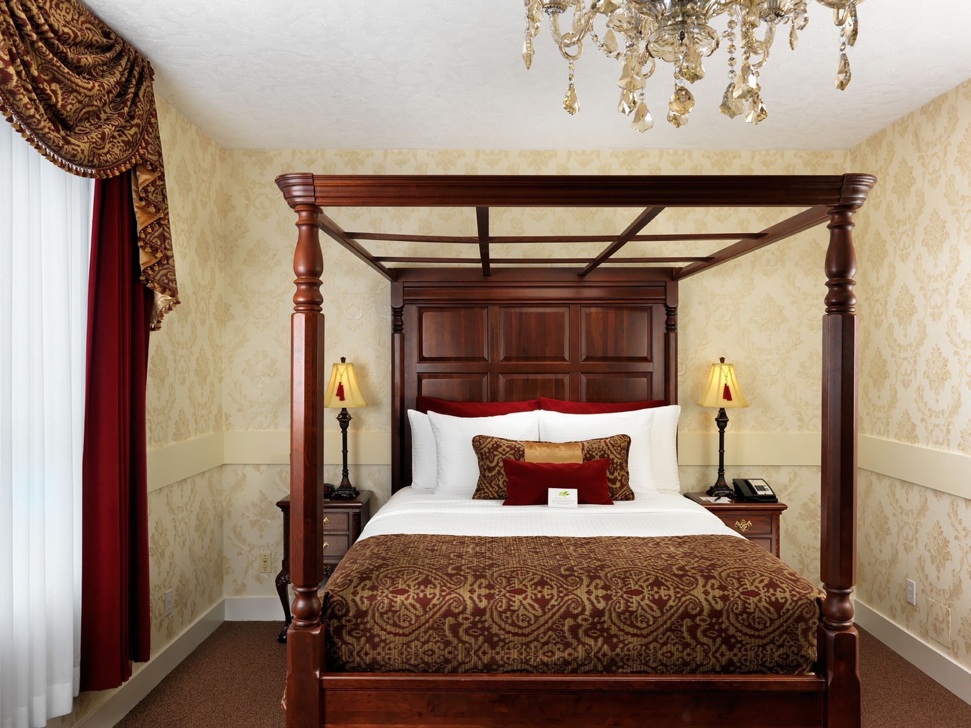 Four poster bed & wooden interior in Notre Dame Room at Pendray Inn & Tea House
