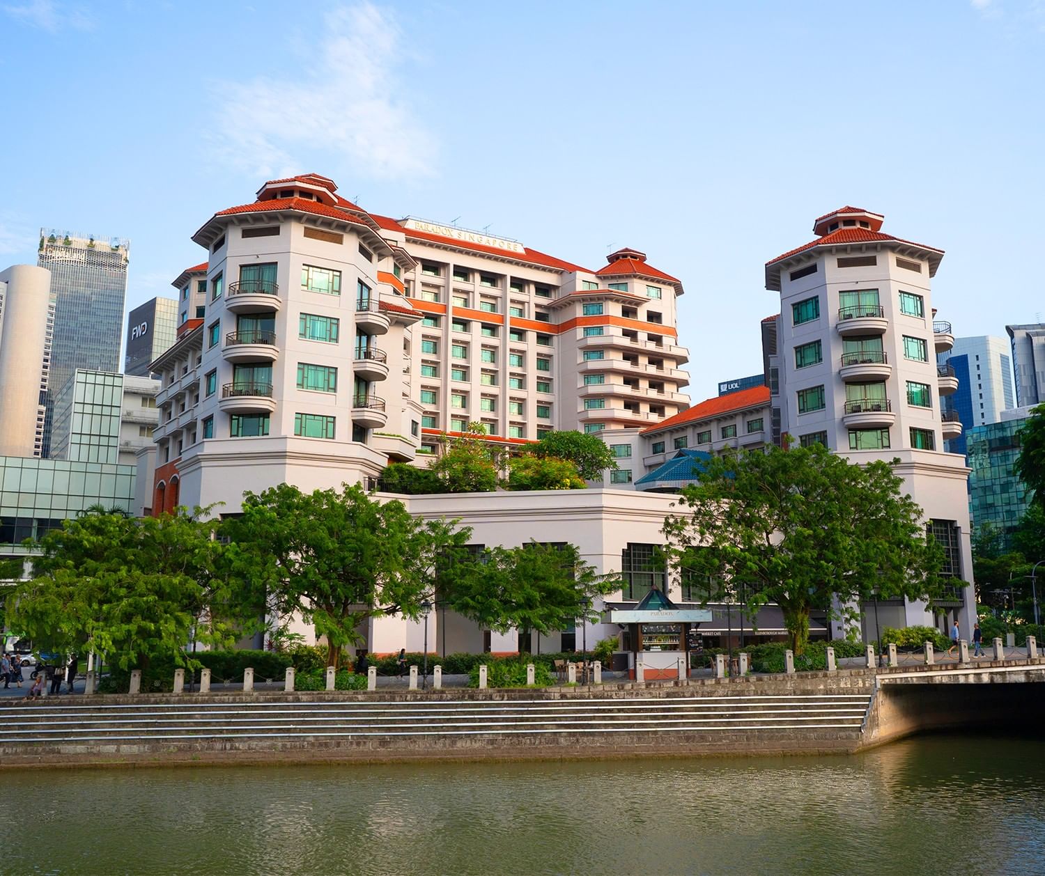 Outdoor swimming pool area with the exterior of Paradox Singapore