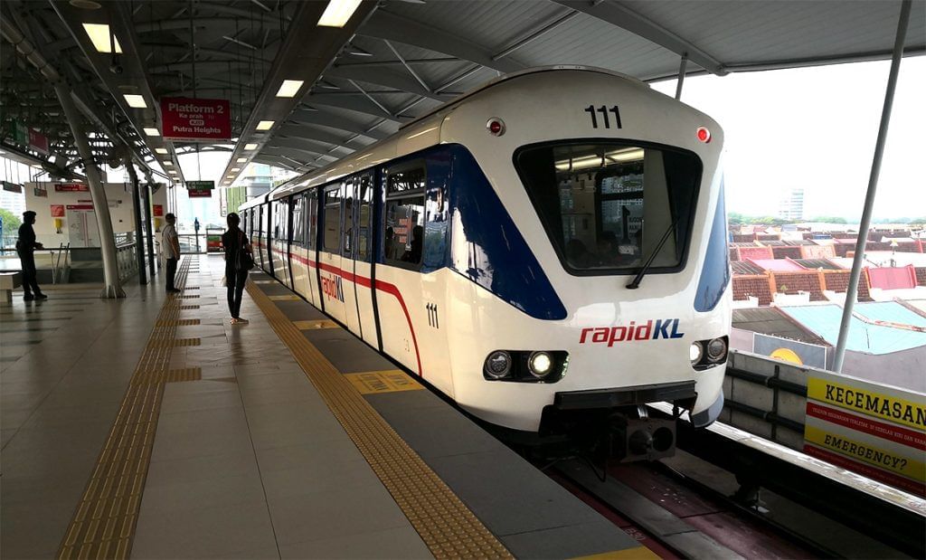 A girl waiting for a LRT train in a platform near Sunway Hotel