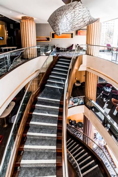 High angle view of the stairway & lobby at Amora Hotel Sydney