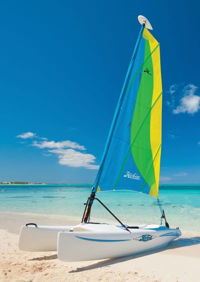 A view of sail boat on beach at Windsong Resort On The Reef