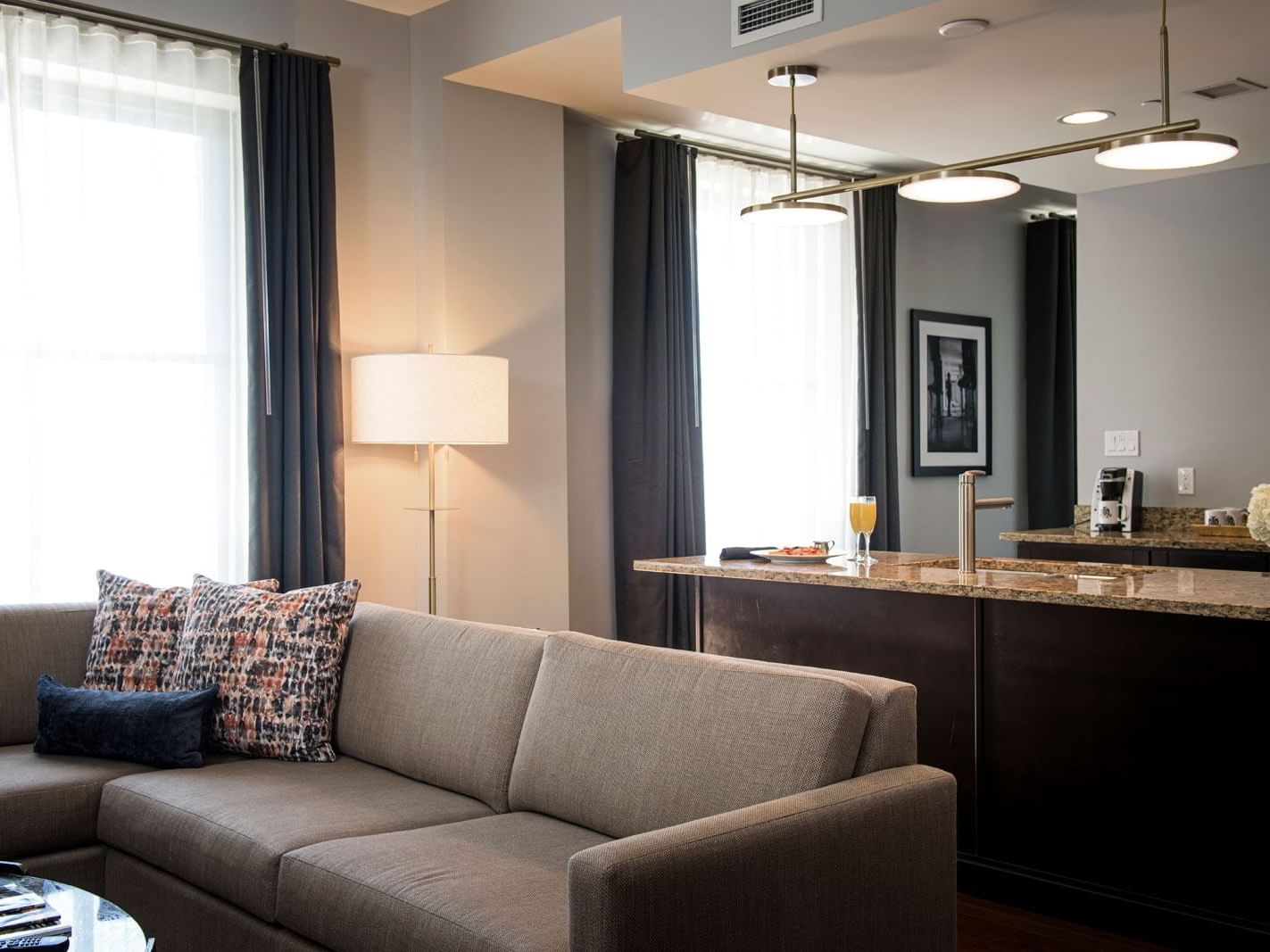 Living area & kitchen in Signature Suite at The Mayo Hotel