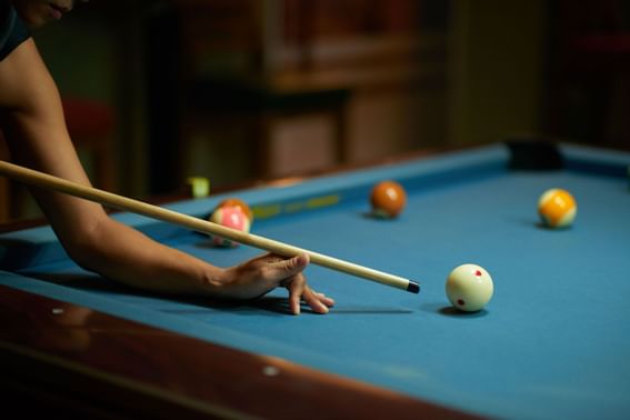 Close up of a man playing pool at Danna Langkawi Hotel