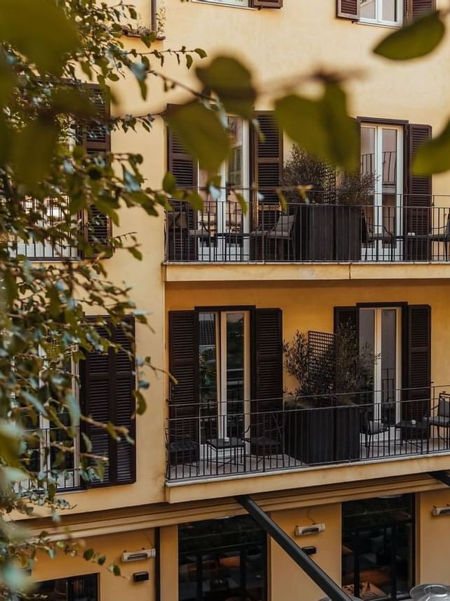 Exterior view of the hotel featuring black windows & balconies at Margutta 19