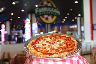 Freshly baked pepperoni pizza served in Farruggio's Pizzeria located at Margaritaville Resort Biloxi