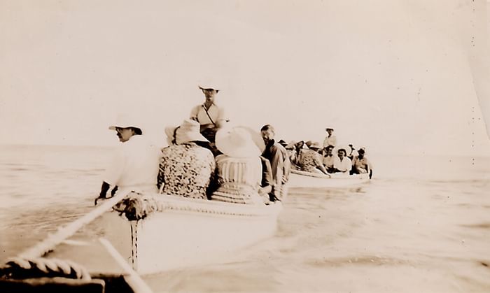 Old photo of People on 2 rowboats near Heron Island Resort