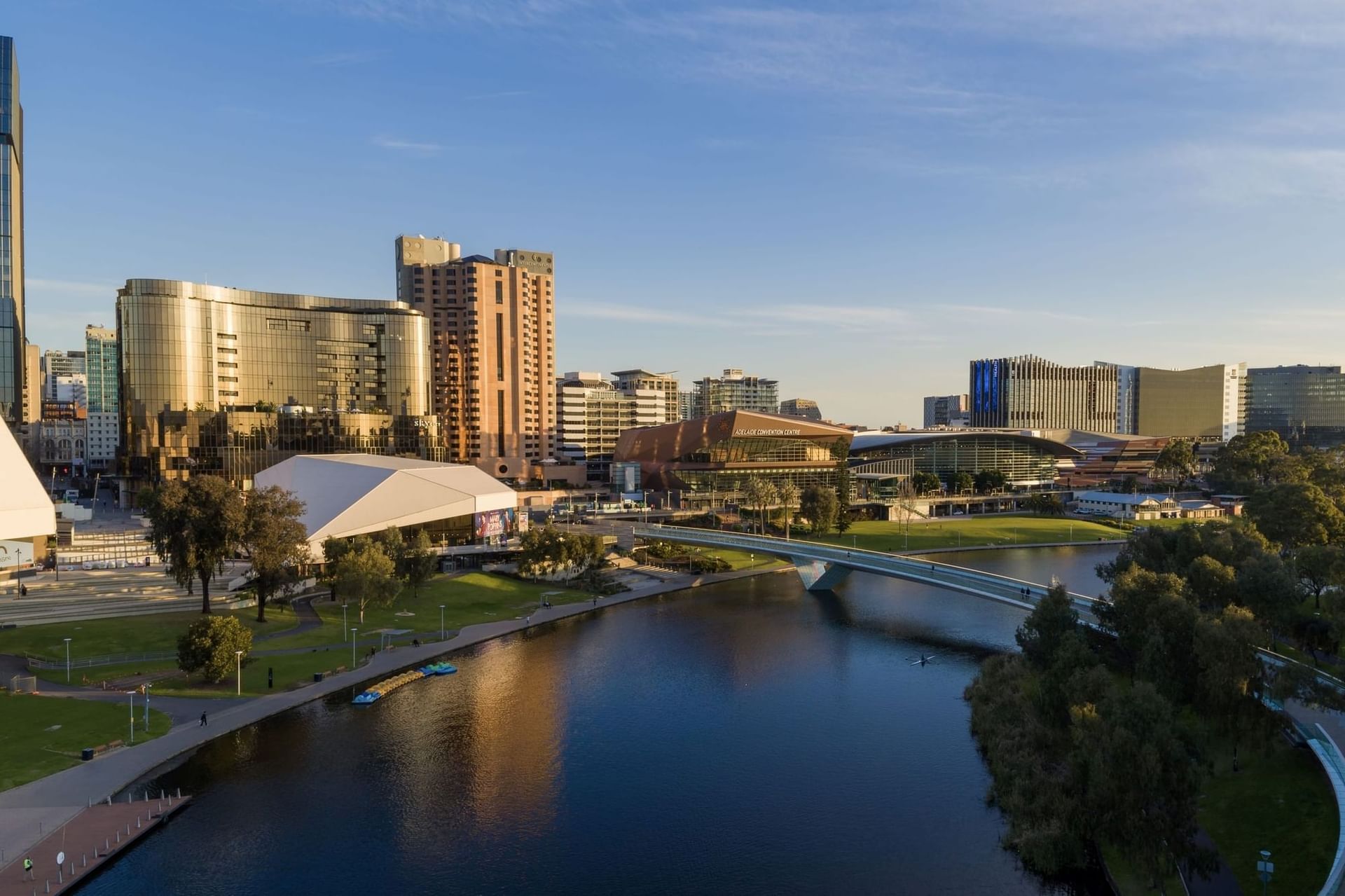 Elevated view of a city with a river and pedestrian bridge at Hotel Grand Chancellor Adelaide