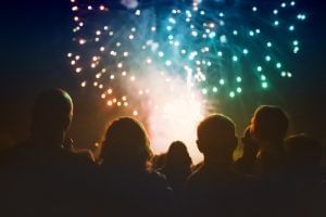 A group of people watching fireworks at Rosen Inn Universal