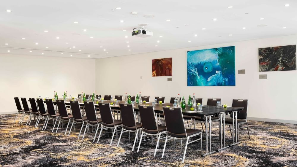 Boardroom set-up with carpeted floors in The Barossa Room at Novotel Sydney on Darling Harbour