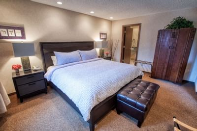 Bed area view of the room at Sophie Station Suites 
