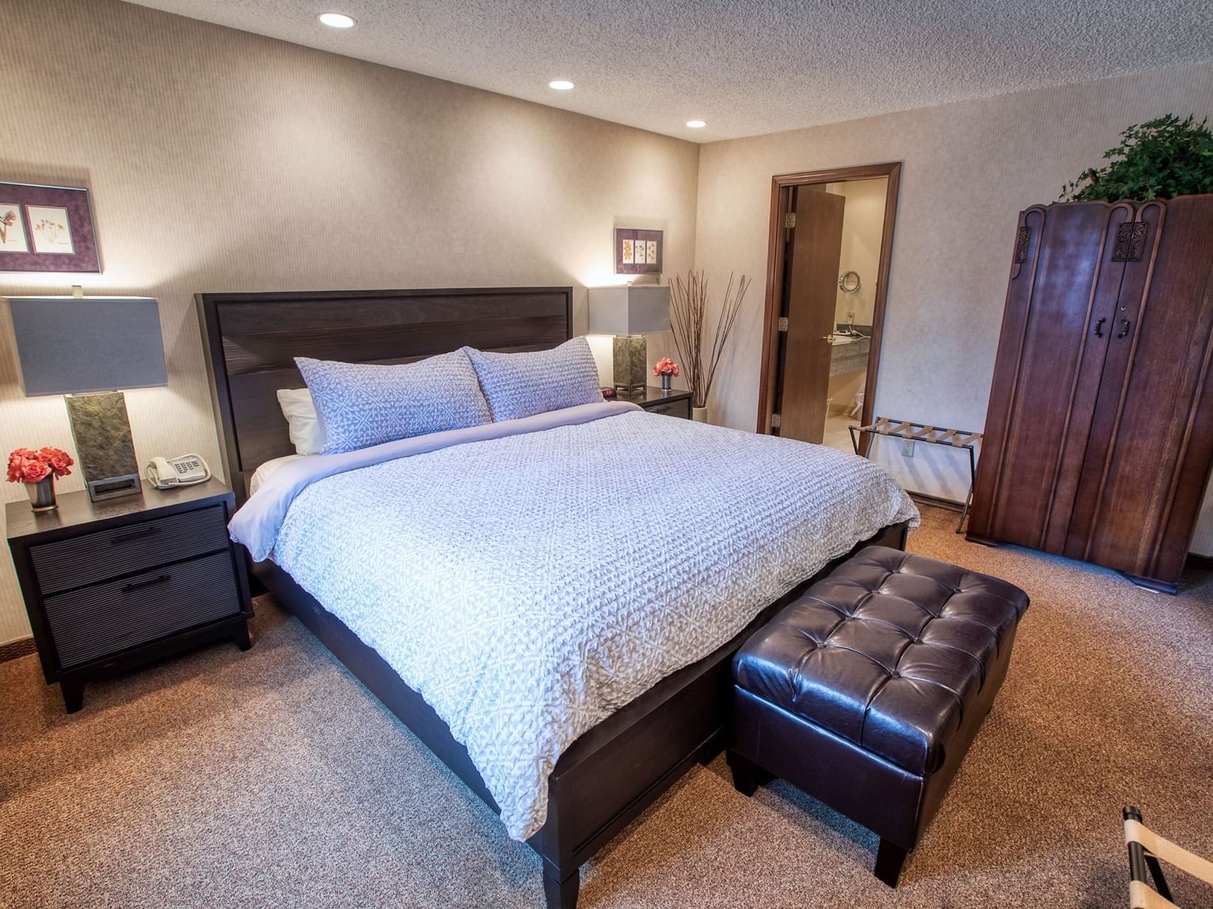 Bed area view of Jacuzzi Suite at Sophie Station Suites