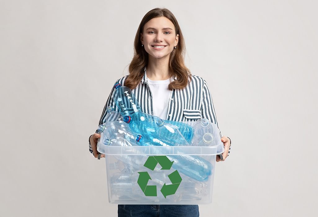 women holding a box with recycle goods inside