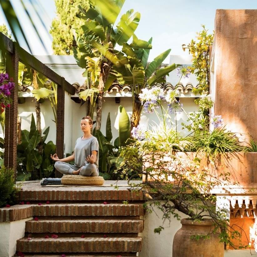 Woman practicing yoga at the holistic studio at the Marbella Club 