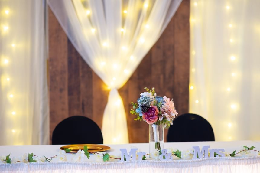 Elegant wedding head table at Rodd Grand Yarmouth, one of the best hotels in Yarmouth, Nova Scotia for celebrations