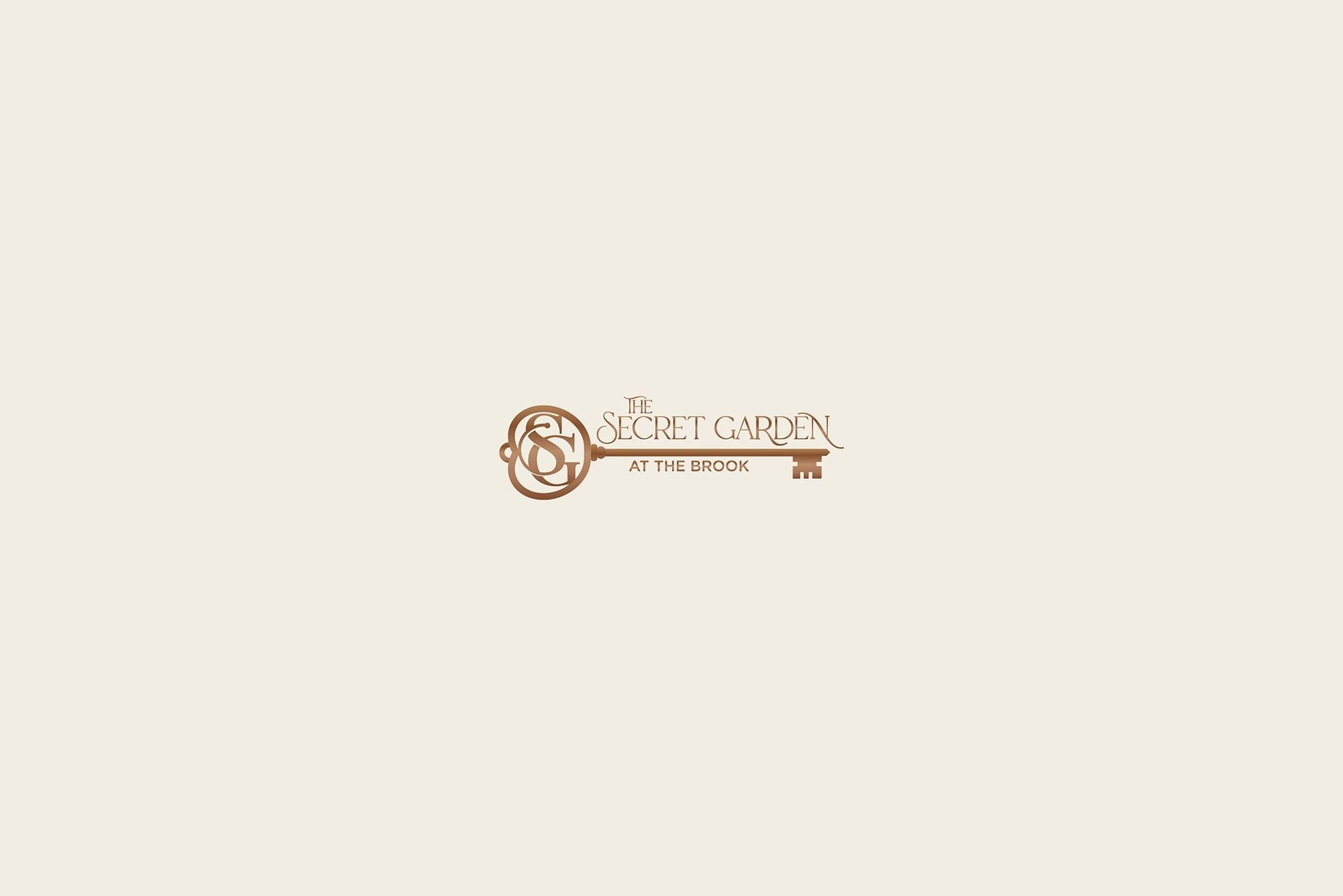 Key logo with blue butterflies floating around text reading The Secret Garden at The Brook