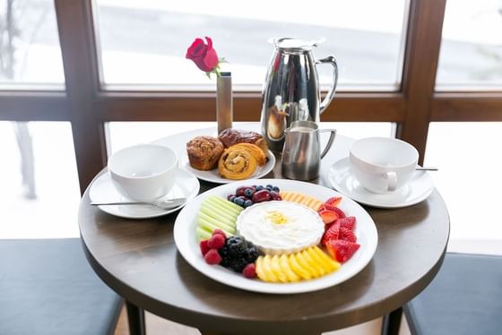 Fruit plate and breakfast pastries 