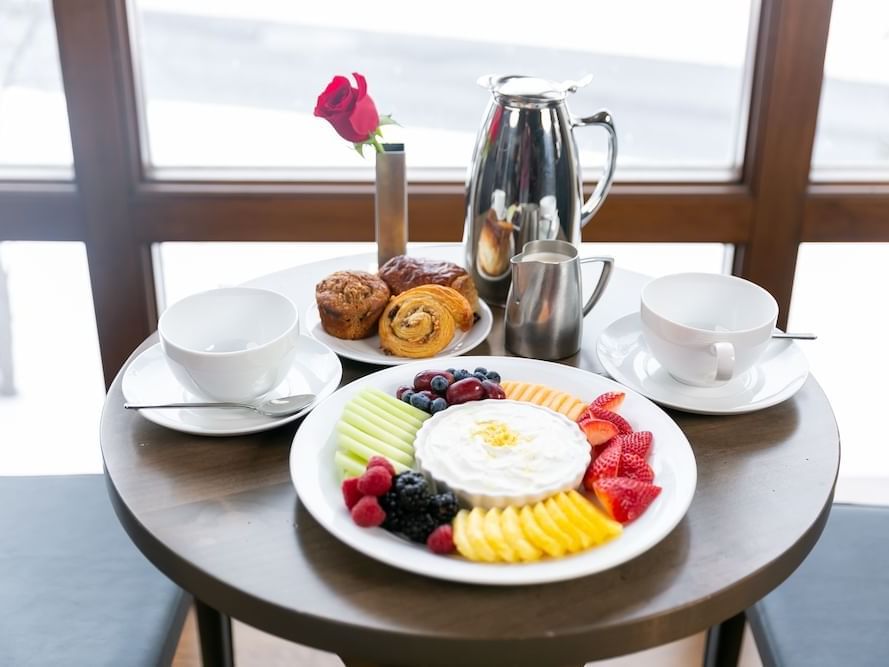 Breakfast served with coffee and fruits in a room at Stein Eriksen Lodge