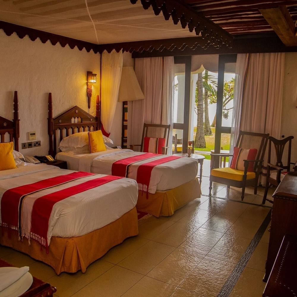 Deluxe Twin Garden View room with two beds at Serena Beach Resort & Spa in Mombasa.
