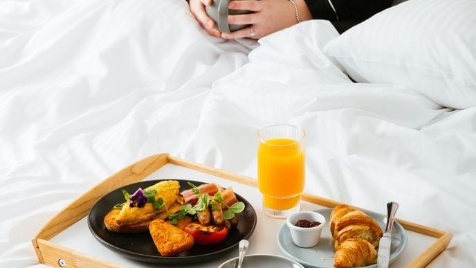 Breakfast meal served on a bed at Novotel Glen Waverley