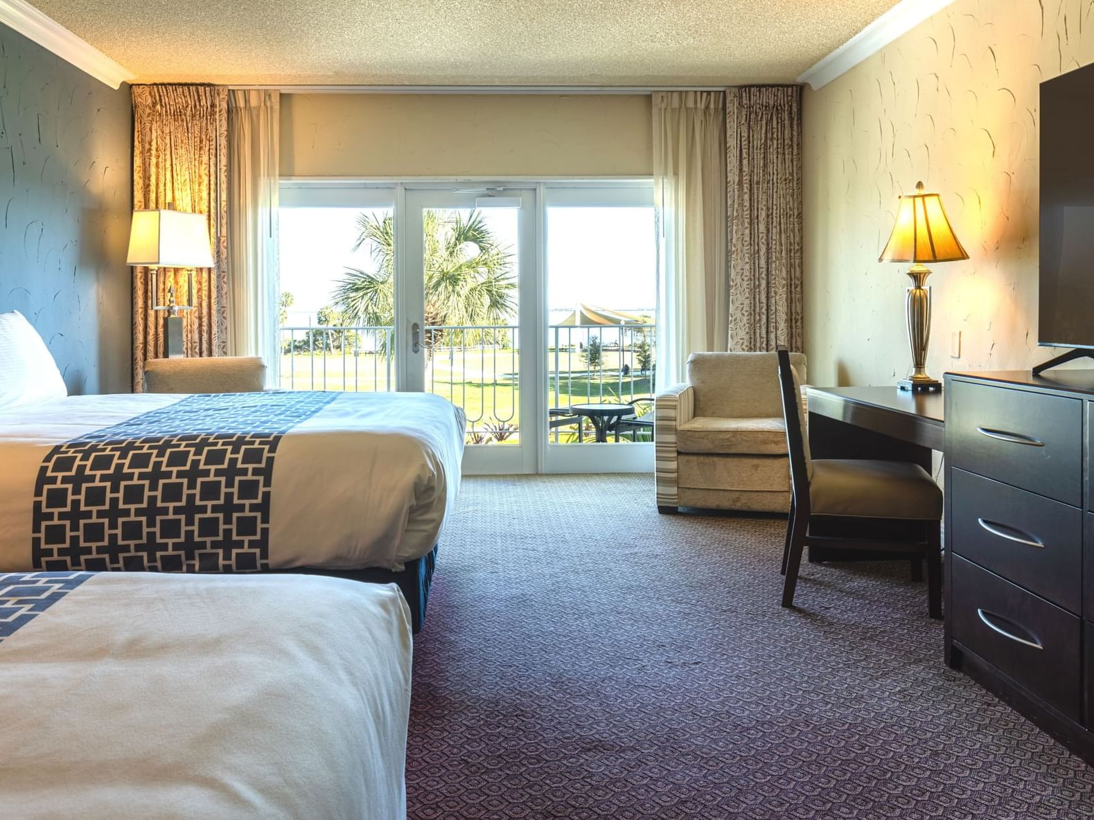 2 Queen Beds Deluxe Room with Patio or Balcony at Safety Harbor Resort & Spa in Tampa Bay, FL.