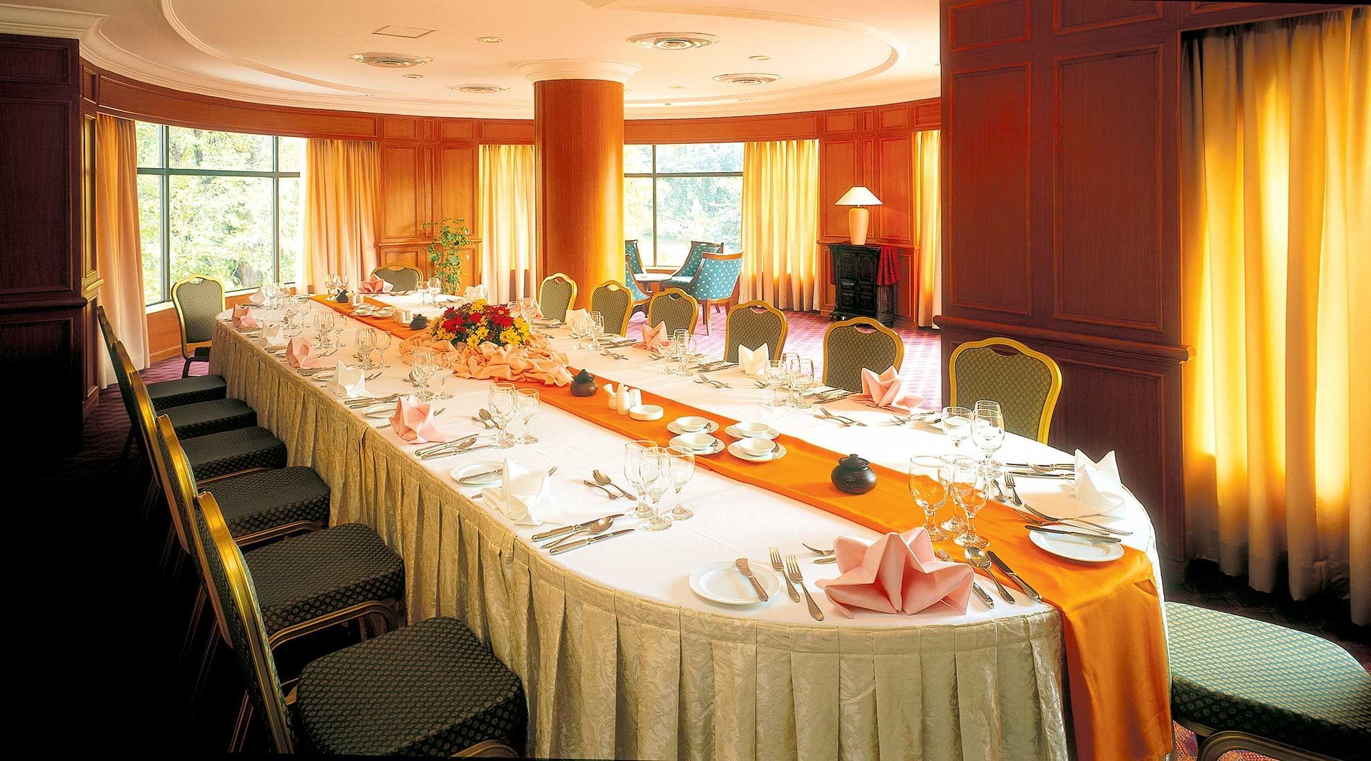 Long table set up with flowers & cutlery for an Event at Sunway Hotel Phnom Penh