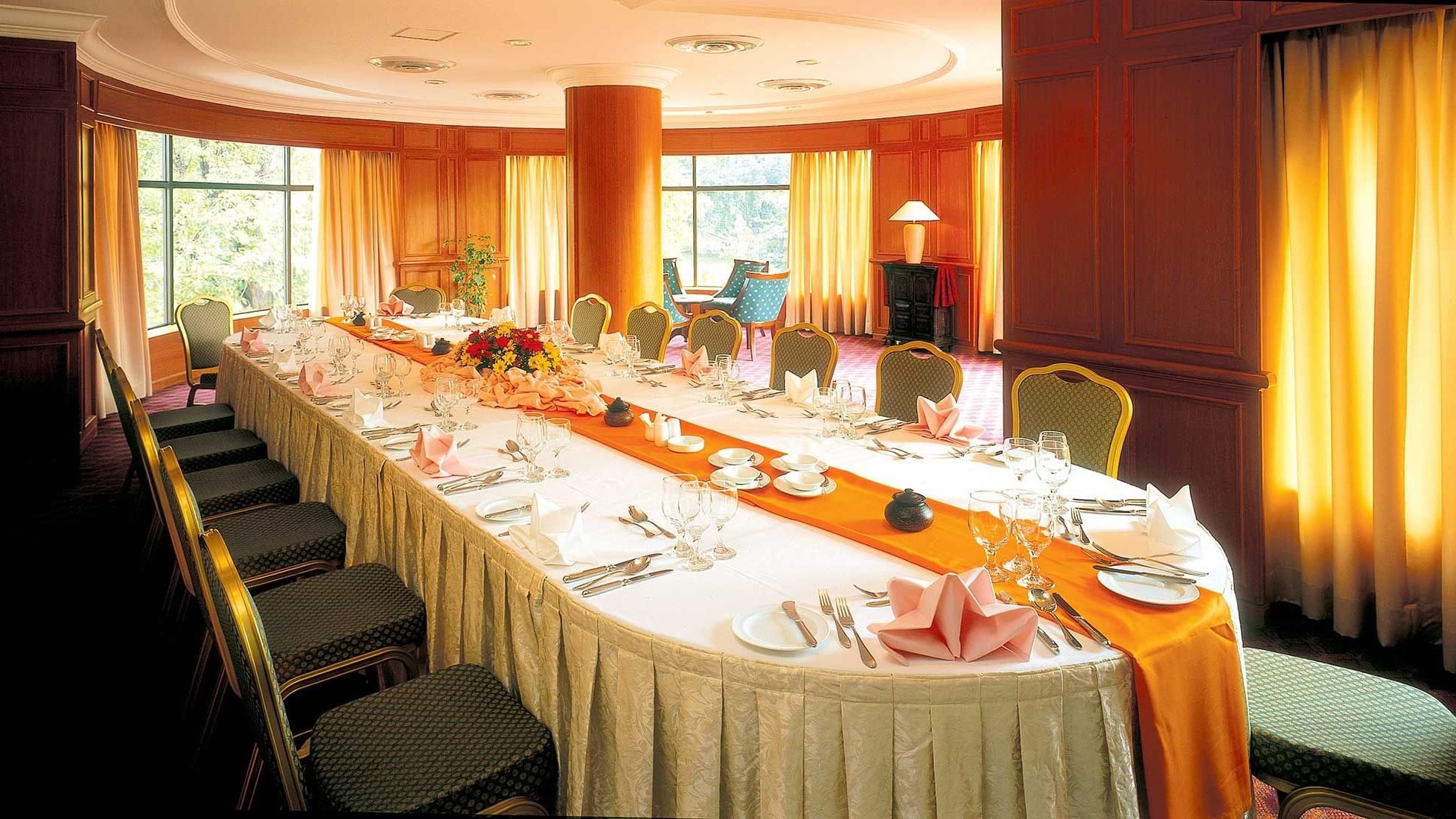 Long table set up with flowers & cutlery for an Event at Sunway Hotel Phnom Penh