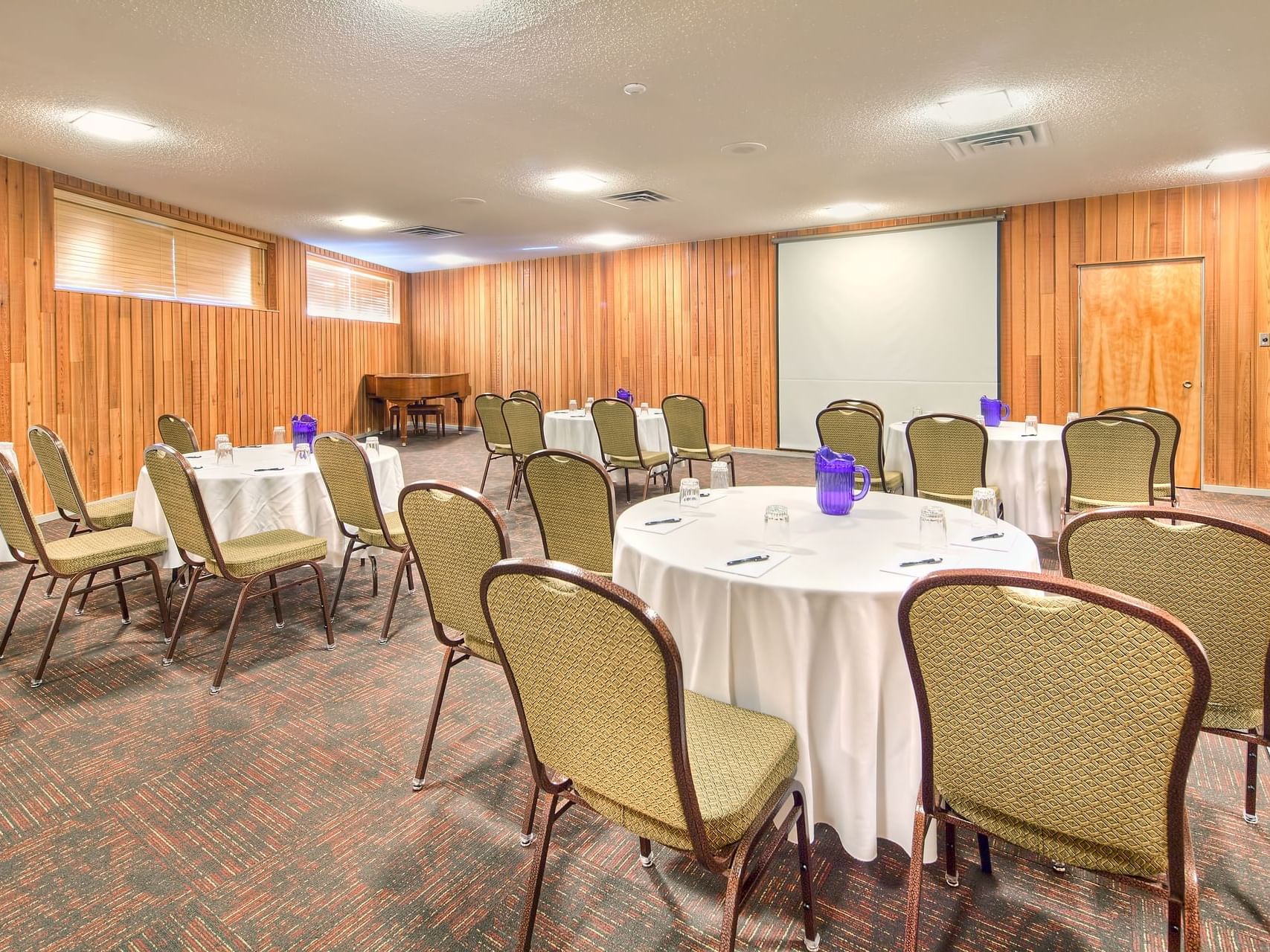 Round meeting tables arranged in Brich Room at Fairmont Hot Springs Resort