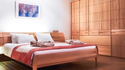 King Executive Suite bedroom with wardrobe at Ana Hotels Sport