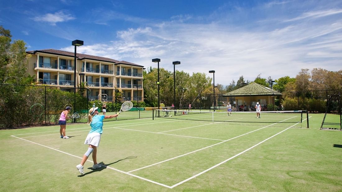 Playing tennis in the tennis court at Mercure Gold Coast Resort