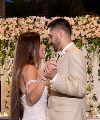 A wedding couple dancing in reception at Copamarina at night