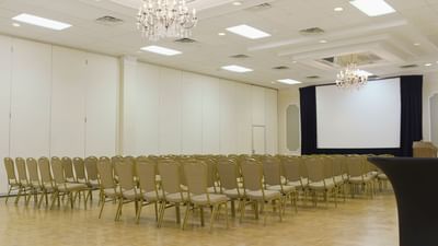 large conference hall with chandelier at the Inn Of Waterloo