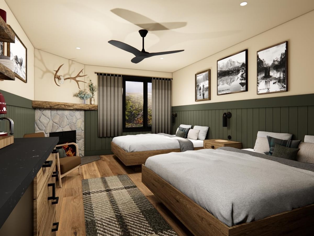 Spacious suite with two queen beds, fireplace, and views.