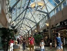 Visitors walking by shops in Prudential Center shopping mall, Downtown Boston shopping near The Eliot Hotel