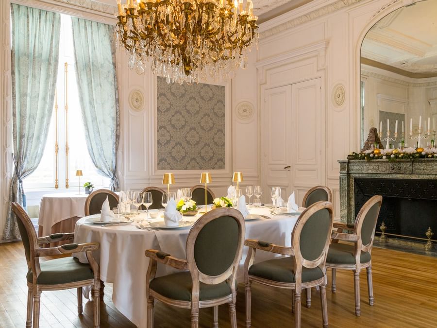 Dining table setup in a room at Chateau de Dissay