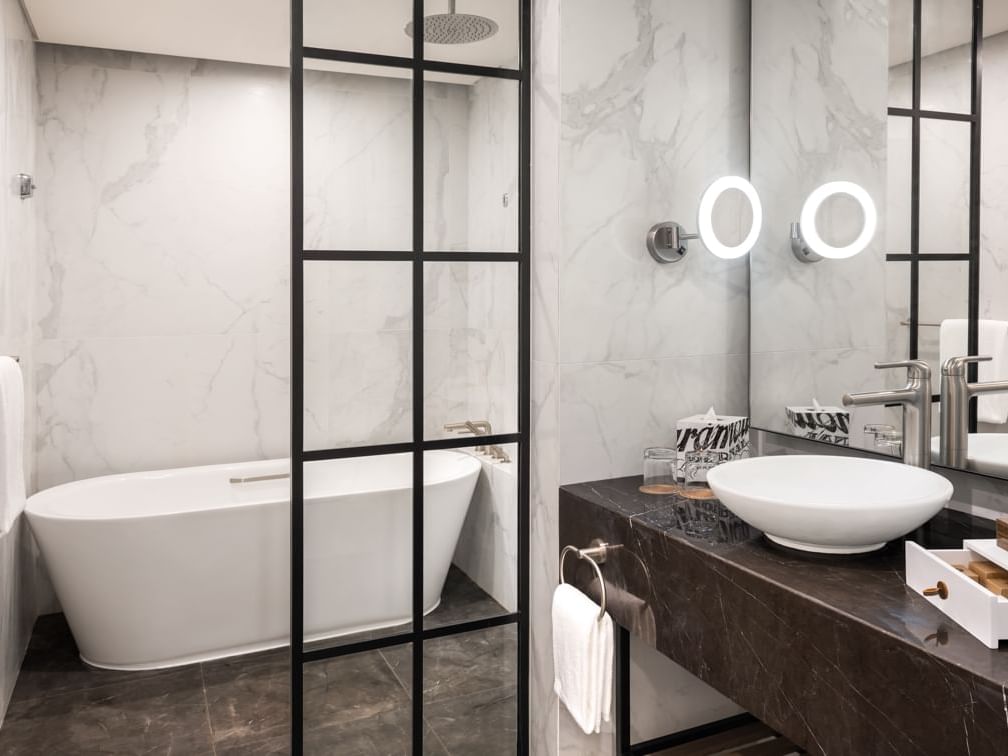 Bathtub and bathroom vanity in Scene Room Duet at Paramount Hotel Midtown