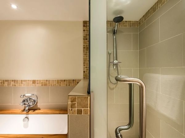 Bathroom Shower & bathtub in a Suite at Warwick Fiji