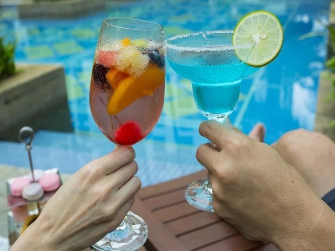 Cocktails served in the pool bar at Chatrium Royal Lake Yangon