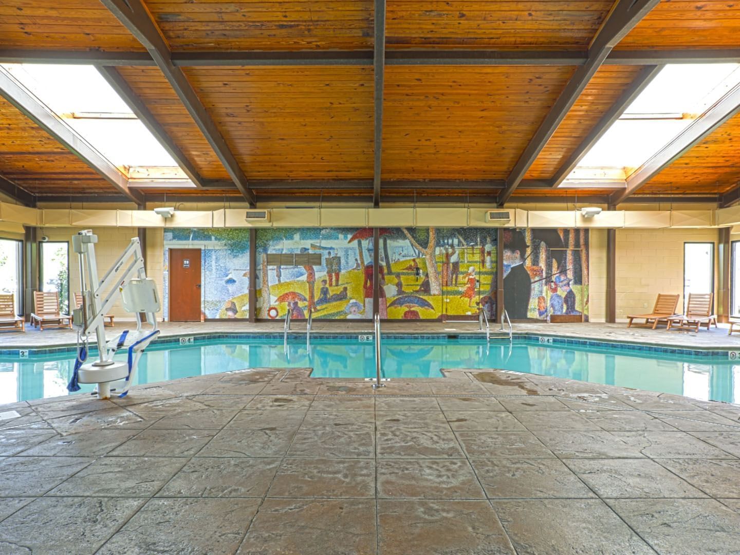 Lounge chairs by the indoor pool at Music Road Resort