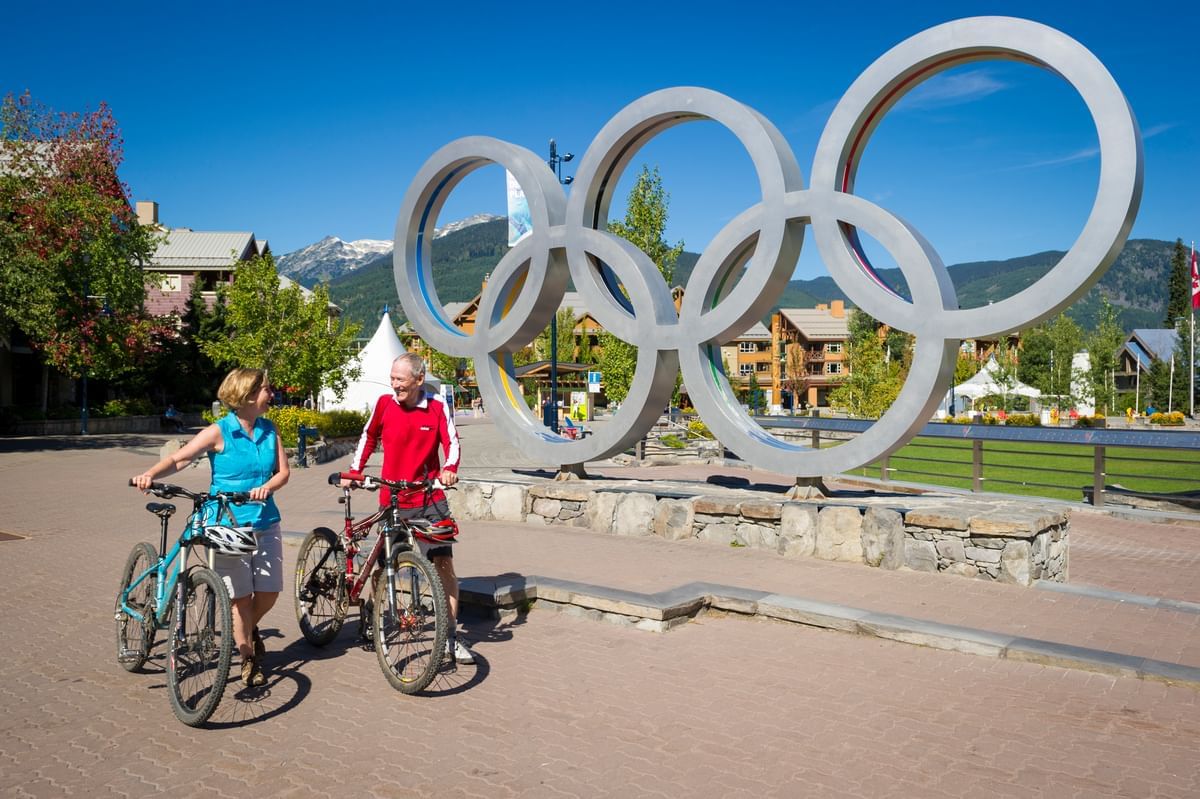 Fall colors and Olympic rings at the Whistler Village Plaza Photograph by  Pierre Leclerc Photography - Fine Art America