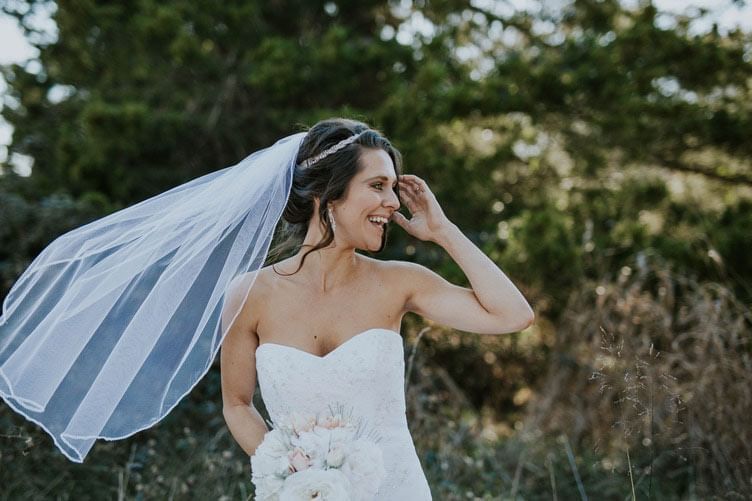 Bride adjusting her hair